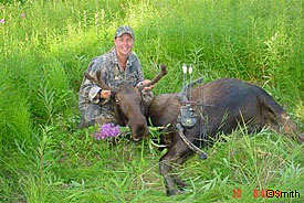 Bowhunter Mary LeFebvre with a North Kenai moose taken on the opening day of the 2003 bull season Photo by Roy Smith