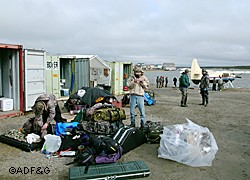 Hunters prepare for departure with one of the nonlocal transporters that operate out of container vans at the Kotzebue Airport during the hunting season