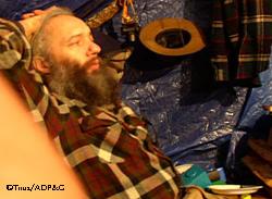 LaVern Beier relaxes in camp after spending the day deer hunting on Admiralty Island Photo by Kim Titus