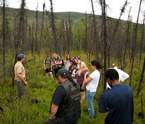 Mike Taras teaches wildland fire ecology to a group of students from the University of Alaska Fairbanks