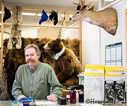 CHris Frary at the front counter in the Douglas Fish and Game office Photo by Mark Henspeter