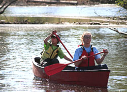 Canoeing and boating safety are some of the many practical and fun handson skills learned during the Alaska Conservation Camp Camp Counselor Rachael Stewart on right and camper Dylan Edwards practice paddling as they maneuver through a slough ADFampGACC photo