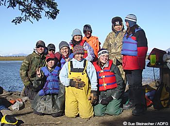 Students from the village of White Mountain teamed up with Fish and Game biologists in September to collar caribou L to R teacher Chris Brown back row black cap Paul Tomalonis red cap Becca Haviland Crystal Lincoln front  yellow bibs Mi