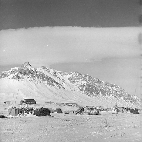 View of Anaktuvuk Pass Alaska with skins hanging on racks at right in1962 Ward Wells Collection Anchorage Museum B1983091S3421108