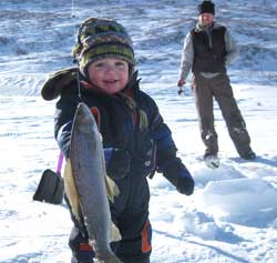 River ice fishing for Arctic grayling Caden Schwankes smile says it all
