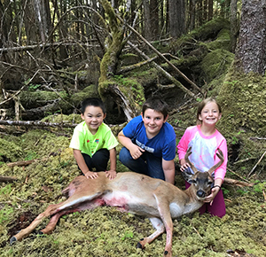 Brooks Blake and Clair Parker with Clair39s first big game animal harvested on Prince of Wales Island Photo by Ben Parker