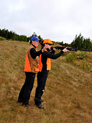 Samantha Oslund Division of Sport Fish helps coach a BOW participant who is learning how to shoot