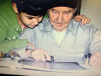 Don and granddaughter Brandi looking at an aerial photo of caribou in the early 2000s Photo courtesy Don and Mary Williams