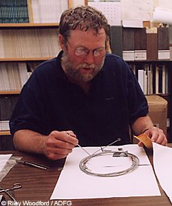 Alaska brown bear researcher Rod Flynn removes wooly tufts of brown bear hair from a snare in his Douglas office The DNA from the hair will fingerprint the individual bear