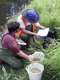 J Johnson and Joe Buckwalter measuring fish