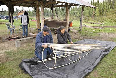 Helen and Wayne Dick making certain that slats and hoops are spaced evenly when lashed to the frame right Photographs by Chris ArendAnchorage Museum