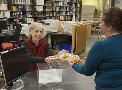 Celia Rozen checking out a fish  Photo by Cody Swanson