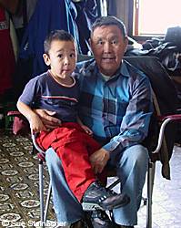 Robert Nick of Nunapitchuk with his grandson and future moose hunter Kenyon Alexie
