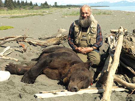 LaVern Beier with Bear 711 on the beach near the Malaspina Forelands
