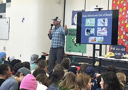 Tom presents bear education at a school assembly Photo by Nikki Scherer