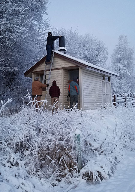 Biology students from UAF conduct a trial run installation of a screen at Pedro39s Monument north of Fairbanks