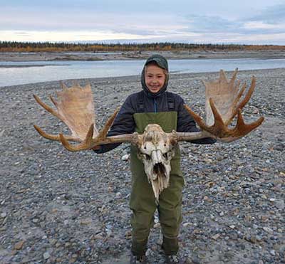 Alexandra Juliussen shows a moose skull she discovered on a gravel bar on the Kuskokwim River Photo by Gabe Juliuseen