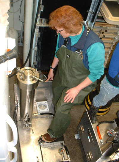 Pioneering fish biologist Diane Loopstra who helped develop these triploiding techniques pressurizes a group of eggs to be triploided in 2010