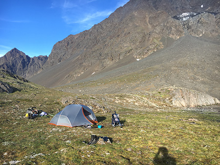 Sheep camp in a narrow steep walled valley