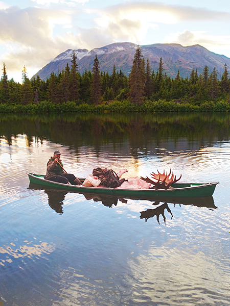The cover of the 20222023 Alaska Hunting regulations featured this photo submitted by Ray Davis Rayrsquos buddy Jim Kazen harvested the moose on a hunting trip on the Kenai Peninsula Their friend Keith Snarey took the picture of Ray paddling the loaded canoe as Keith and Jim walked out along the lake Ray wrote ldquoOne load with the whole moose and all our gearrdquo