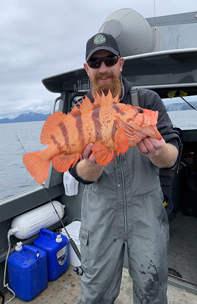 The author with a tiger rockfish This fish was released back to the depth of capture using a deepwater release mechanism