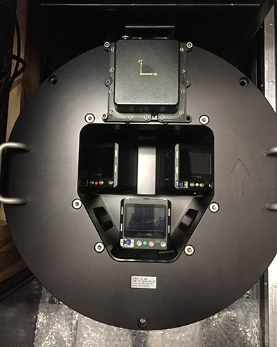 A look up from underneath the aircraft at the digital camera mounted in a pod in the belly of the plane