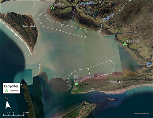 Shallow and muddy Controller Bay Okalee Spit is the peninsula on the lower right with the camp spot marked with a green tent icon The northern tip of Kayak Island is bottom center and Kanak Island is top left The silty Bering River enters the bay at top left