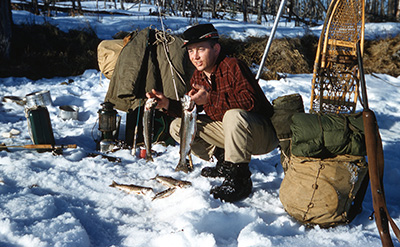 The author39s father displays a pair of rainbow trout he caught in 1959 after snowshoeing into a good icefishing spot on Kenai Lake