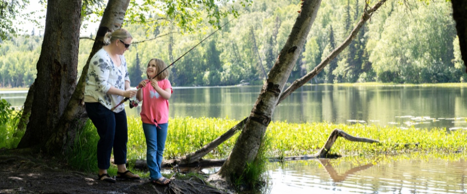 Family fishing outdoors - Alaska Department of Fish and Game