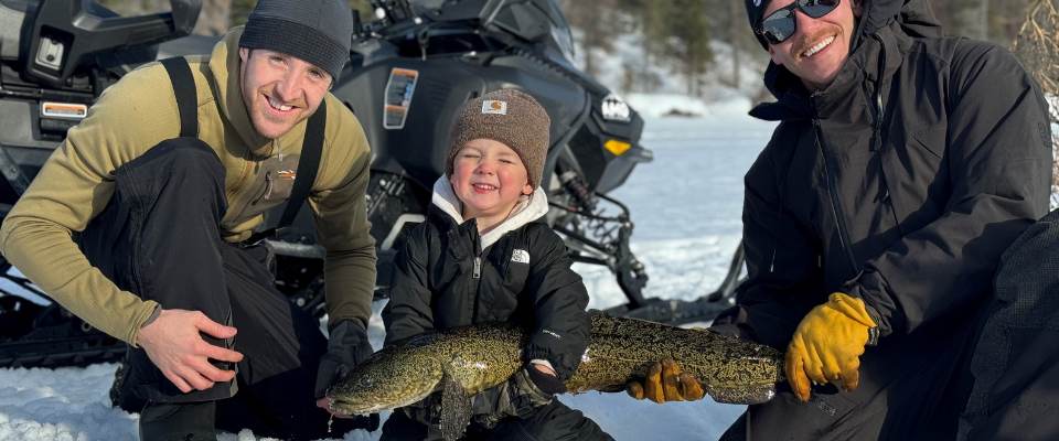 Kid holding a fish - Alaska Department of Fish and Game