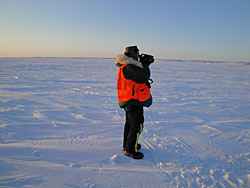 Figure 2 USFWS biologist Craig Perham surveying barrier island denning habitat with a handheld FLIR