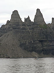 Castle Cape looms large over a seine boat